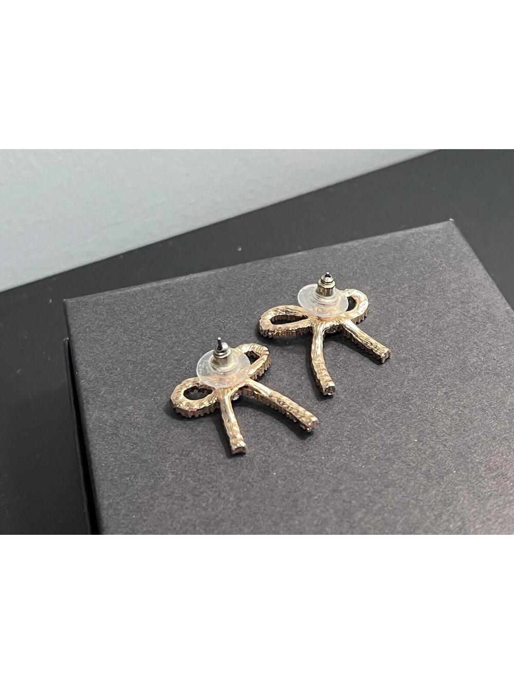 Bow Shaped Stud Earrings in Gold w/ Pave Cubic Zirconia - Picture 4 of 11